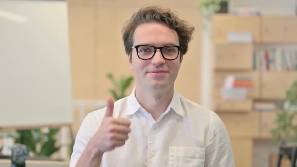 Portrait of Young Man Showing Thumbs Up Sign