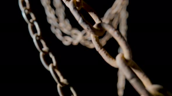 Old Metal Chain with Rusted Links on Black Isolated Studio Background