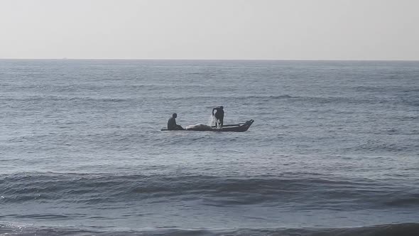 People fishing in ocean in morning, traditional boat fishing in sea. Sea fishing boat in morning.