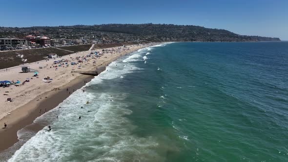 Beachfront Drone Dolly In From Ocean To City