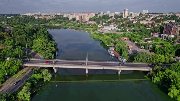 Panoramic View of Small City Near River with Bridge