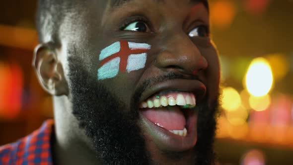 Black Football Fan With English Flag Cheering for Favorite Team Victory, League