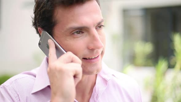 Man talking on cell phone and smiling