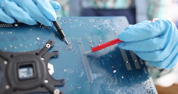 Chip Repairman Testing Circuit Electronics Technician is Testing Computer Chip