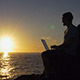 Working on Laptop watching Sunrise - VideoHive Item for Sale