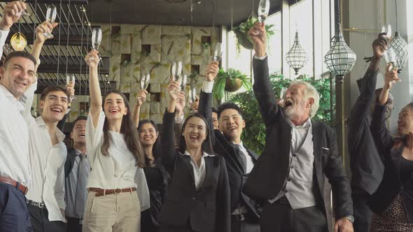 Group of business people toasting champagne to celebrate on New Year