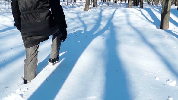 Man Walking in Deep Snow