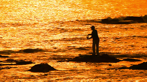 Fisherman With Spinning Silhouette At Sea Sunset