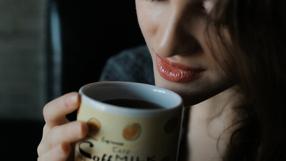 Woman In Drinking Coffee