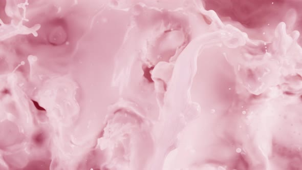 Super Slow Motion Shot of Splashing Fresh Strawberry Milk Liquid at 1000 Fps