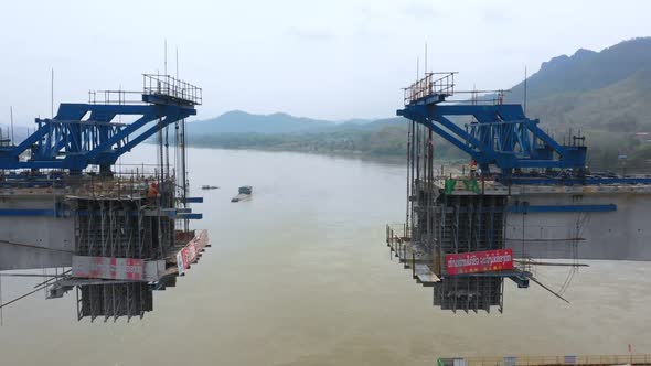 Aerial View Of Construction Over The Mekong River For The High Speed Railway Linking China To Laos