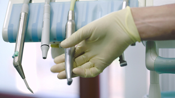 Dentist Putting Tool On Its Place After Using alt