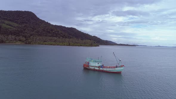 Fishing boats sailing off the coast of an exotic island in Thailand