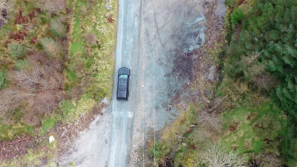 4X4 Pickup Vehicles Driving Through Forest - All Brands Removed