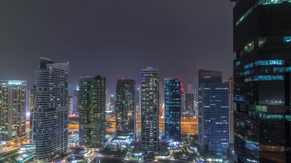 Residential and Office Buildings in Jumeirah Lake Towers District Night Timelapse in Dubai