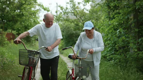 Happy Retirement Couple Leads an Active Lifestyle Enjoy a Bike Ride