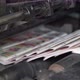 Printed Newspapers are Moved Along Conveyor - VideoHive Item for Sale
