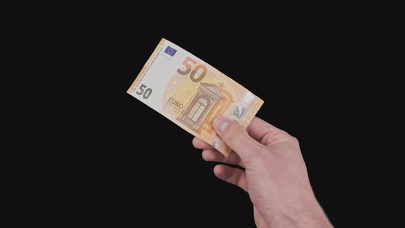 Male Hand Shows a Banknote of 50 Euros with Alpha Channel