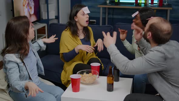 Group of Mixed Race People Enjoying Time Together While Playing Entertainment Guess Who