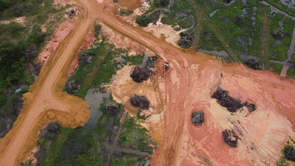 Aerial rotate look down the land clearing of oil palm plantation