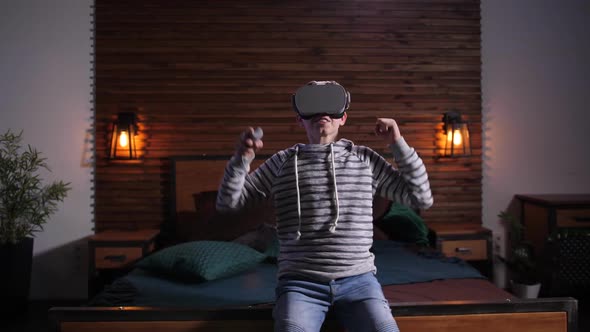 Happy Teenage Boy Enjoying Victory in VR Game