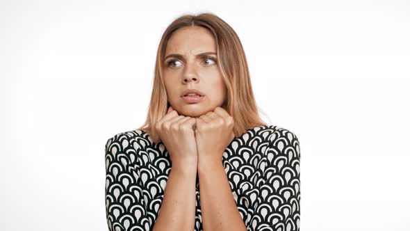 Scared Young Beautiful Blonde Girl Over White Background