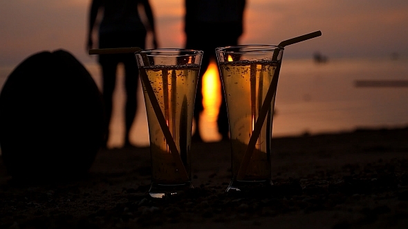 Two Glasses of Soft Drink at Sunset