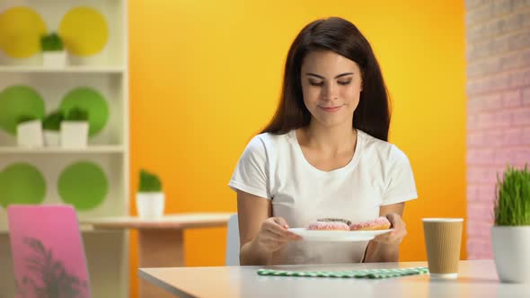 Pretty Smiling Female Holding Plate With Donuts in Hand, Tasty Dessert, Sugar