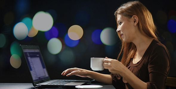 Young Woman Working on Laptop