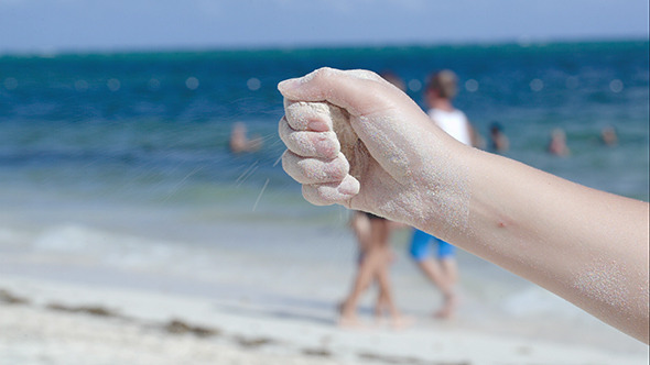 Sand Pouring From Female Hand