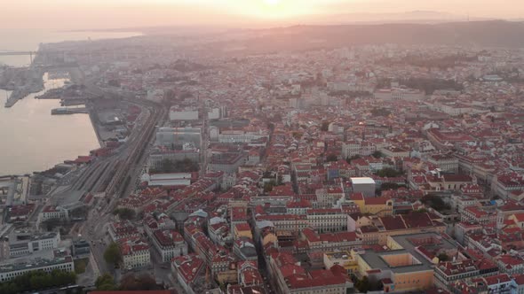 Aerial Slider View of Beautiful Sun Rays Over Lisbon City Center with Colorful Houses and Famous