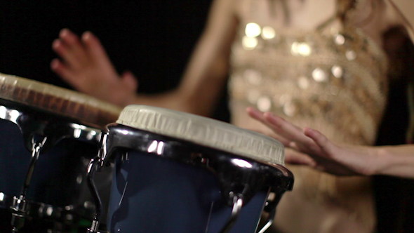 Female Percussion Drummer Performing With Bongos 22