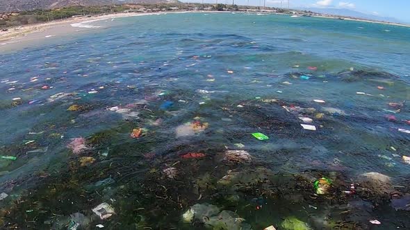 Close up on plastic bags float on sea water surface polluting coast in Vietnam