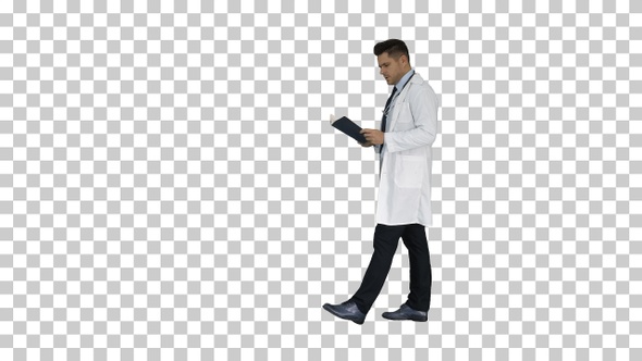 Concentrated medical doctor reading documentation while walking