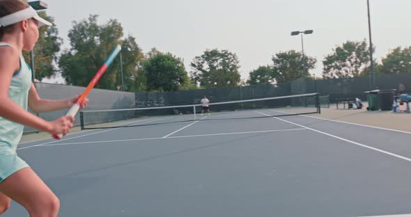 Female Tennis Player During Tennis Match with Her Coach