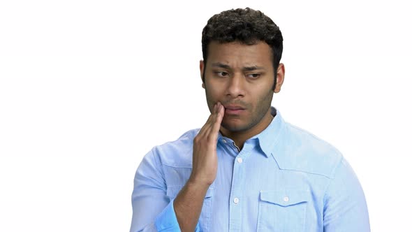 Indian Guy Suffering From Toothache on White Background