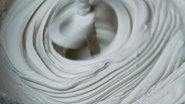 Rotating Whisk Mixer Immersed in Plaster Mix