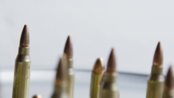 Cinematic rotating shot of bullets on a metallic surface - BULLETS 080