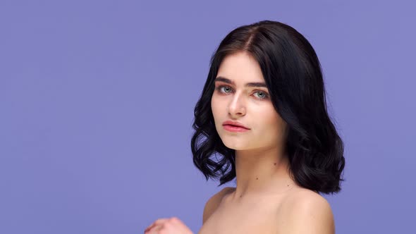 Studio portrait of young and beautiful brunette woman.