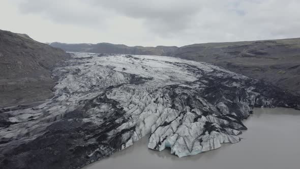 Aerial drone view towards the Solheimajokull Glacier, in gloomy, overcast Iceland