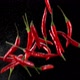 Red chili peppers flying up on black background - VideoHive Item for Sale