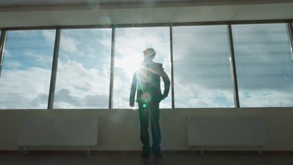 Business Motivation Businessman Stands in Front of a Panoramic Window Morning in a Modern Office