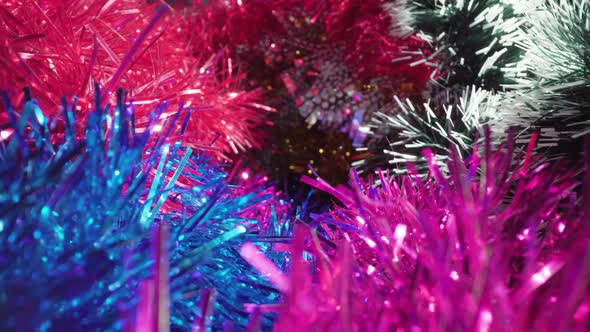 Motion Over Large Pile of Shiny Tinsel Garlands in Studio