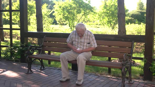 Elderly Man Eating Medicine