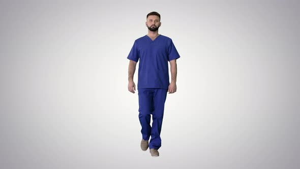 Serious Male Surgeon with a Beard Walking on Gradient Background