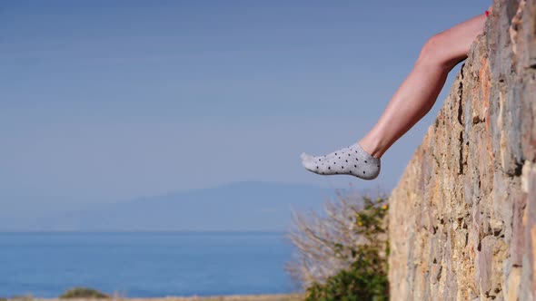 Woman is Waving her Legs Outdoors