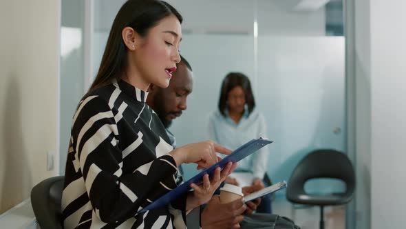 Asian Woman Looking at Cv Resume and Preparing for Job Interview