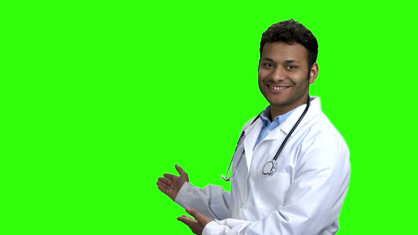 Smiling Doctor Showing Copy Space with Hands