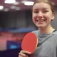 Portrait of a smiling young girl table tennis player with a ping pong racket - VideoHive Item for Sale