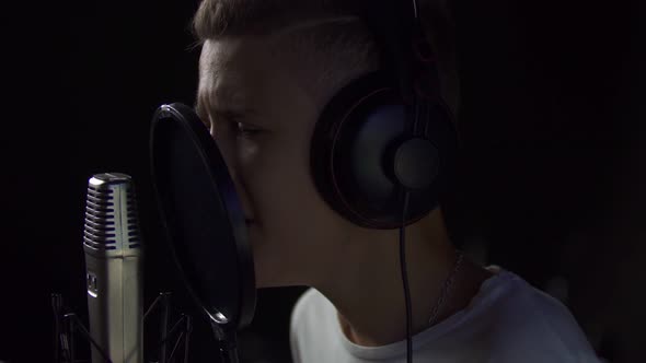 Boy Singing Into Studio Microphone